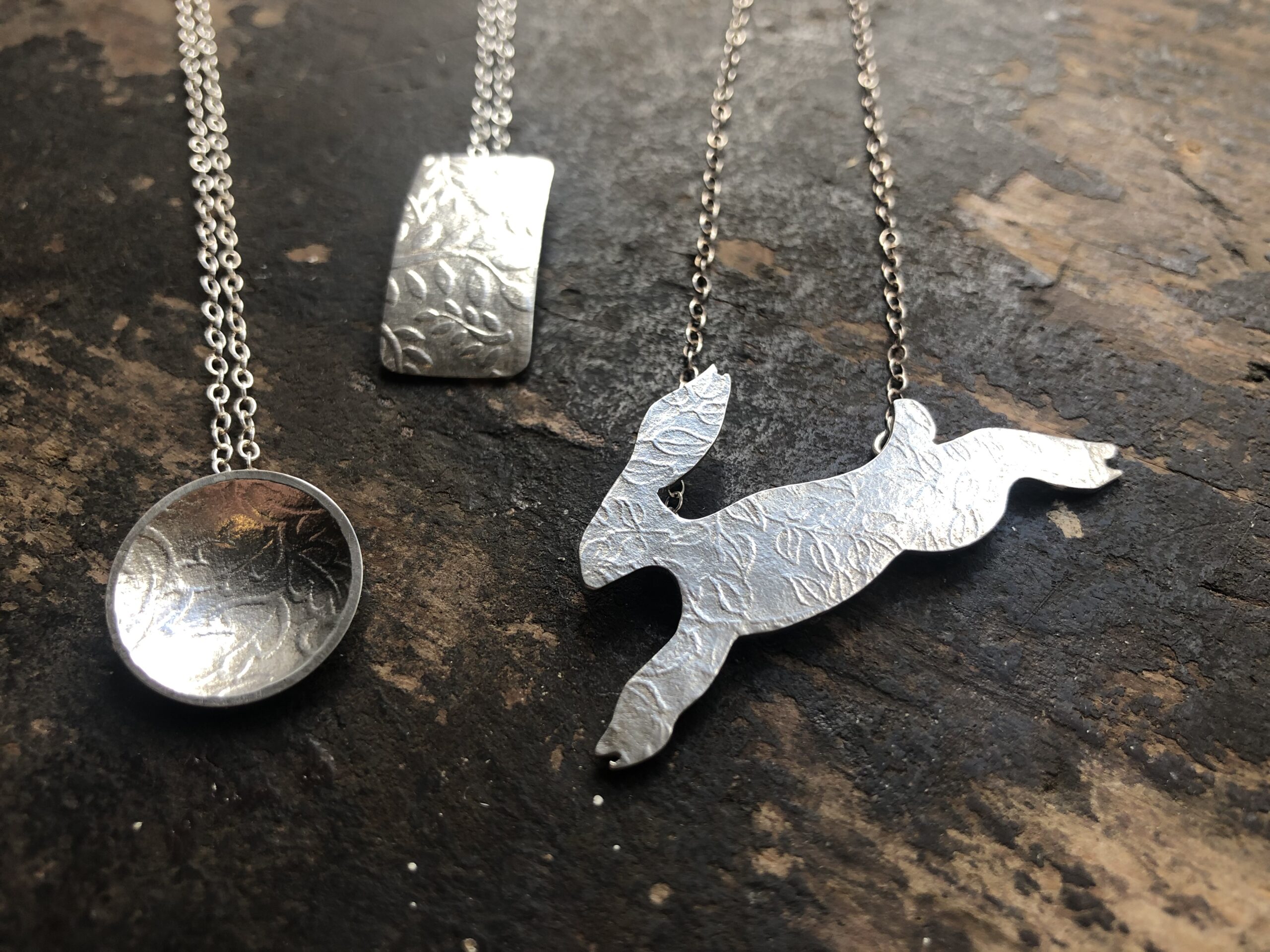 Silver pendents by Joanne Tilney circle rectangle and hare