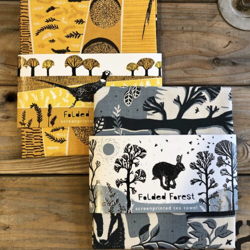 Screen printed tea towels with hare or pheasant by Fold Forest Design
